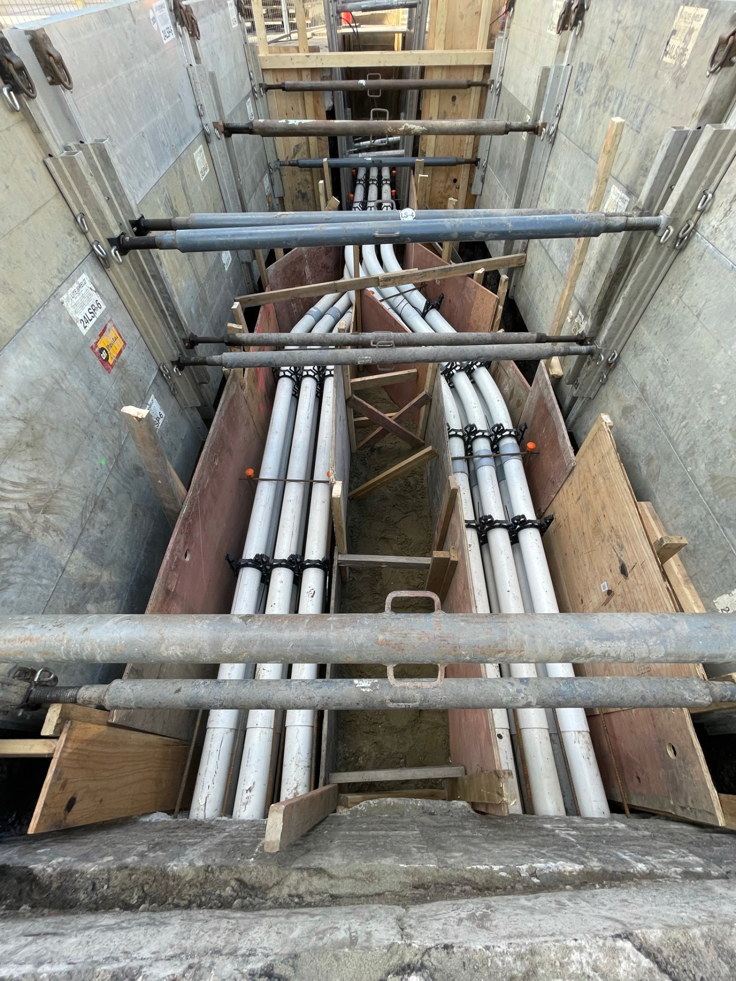 Underground duct bank installation in shored excavation