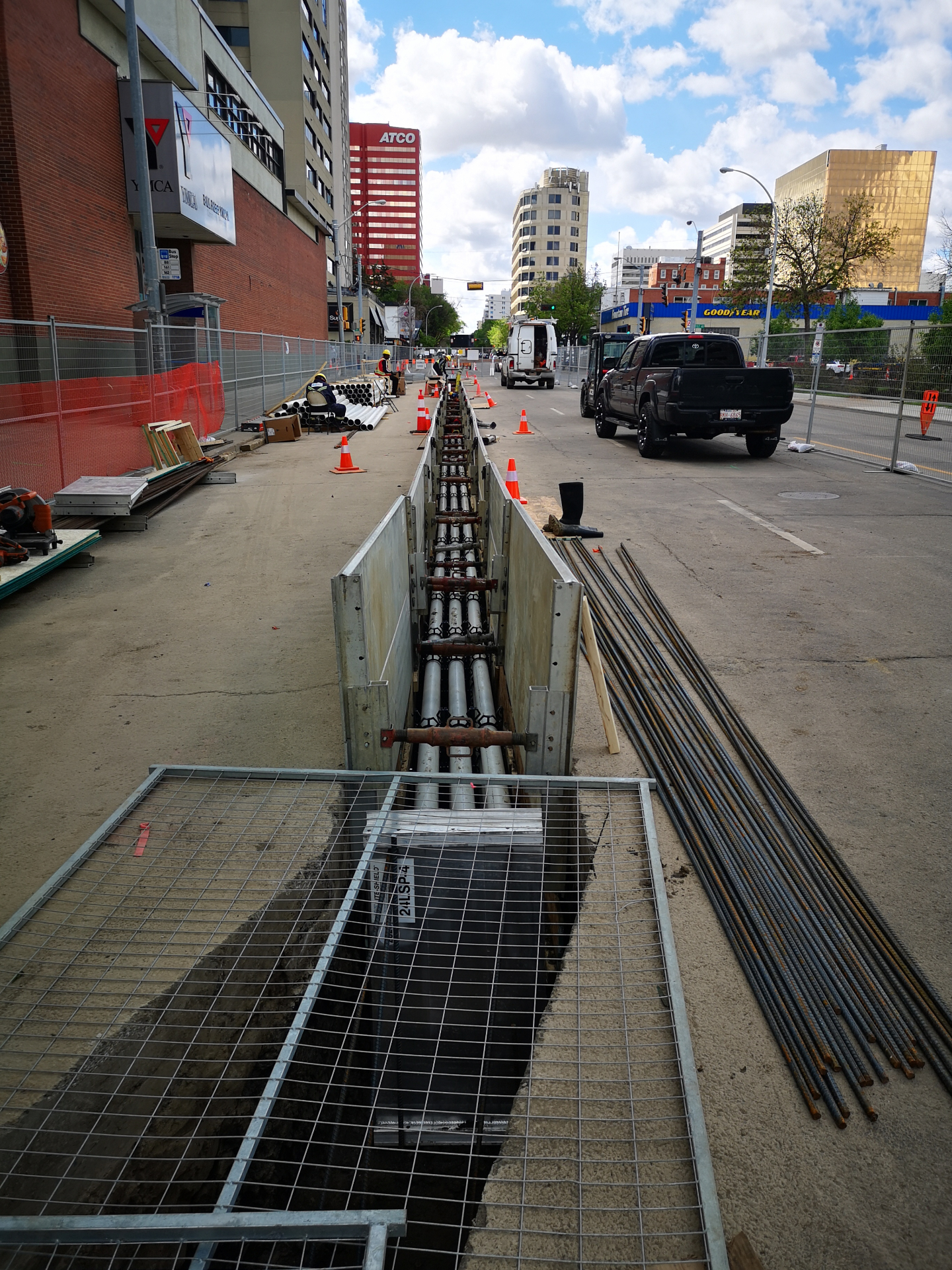 Multi-duct conduit bank in shored trench through downtown street