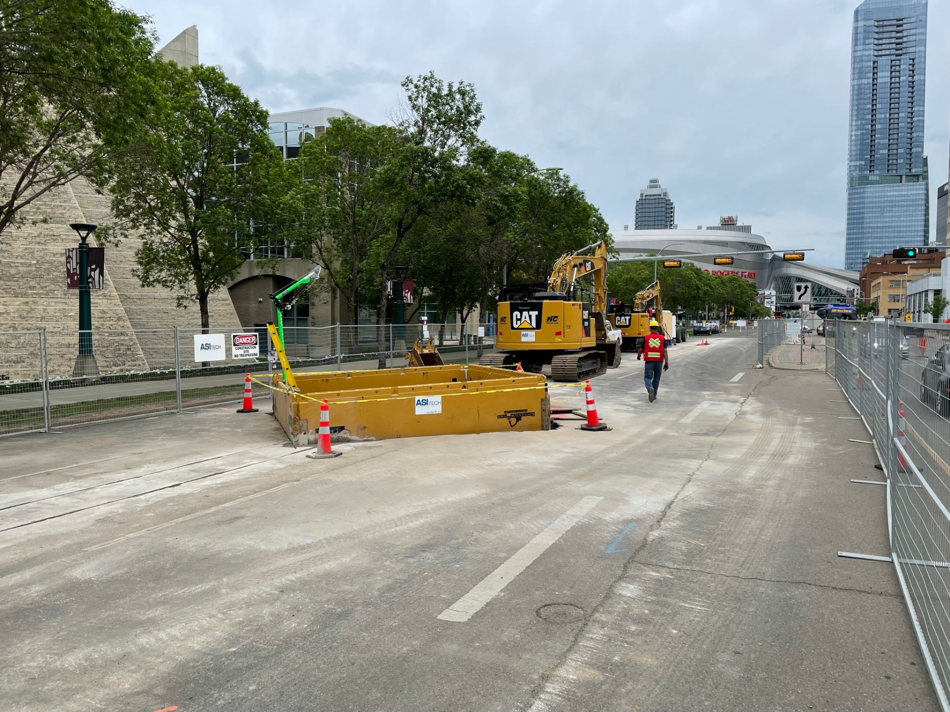 ASI Tech ductbank construction site with CAT excavators and trench boxes