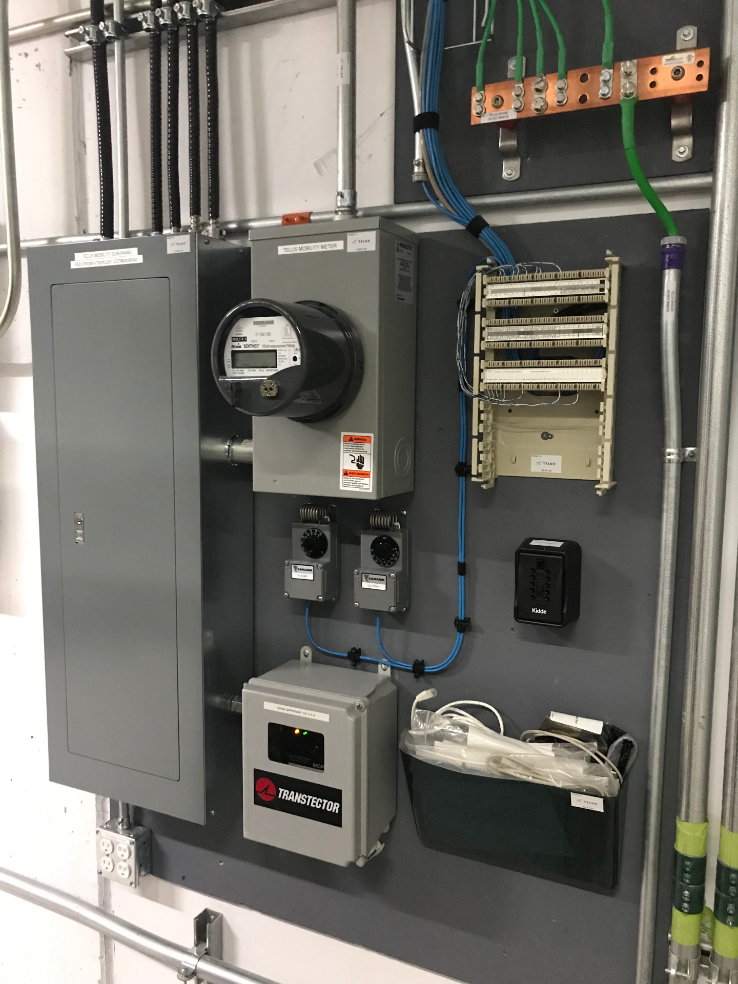 Telus mobility electrical sub-panel, meter and grounding bar installation