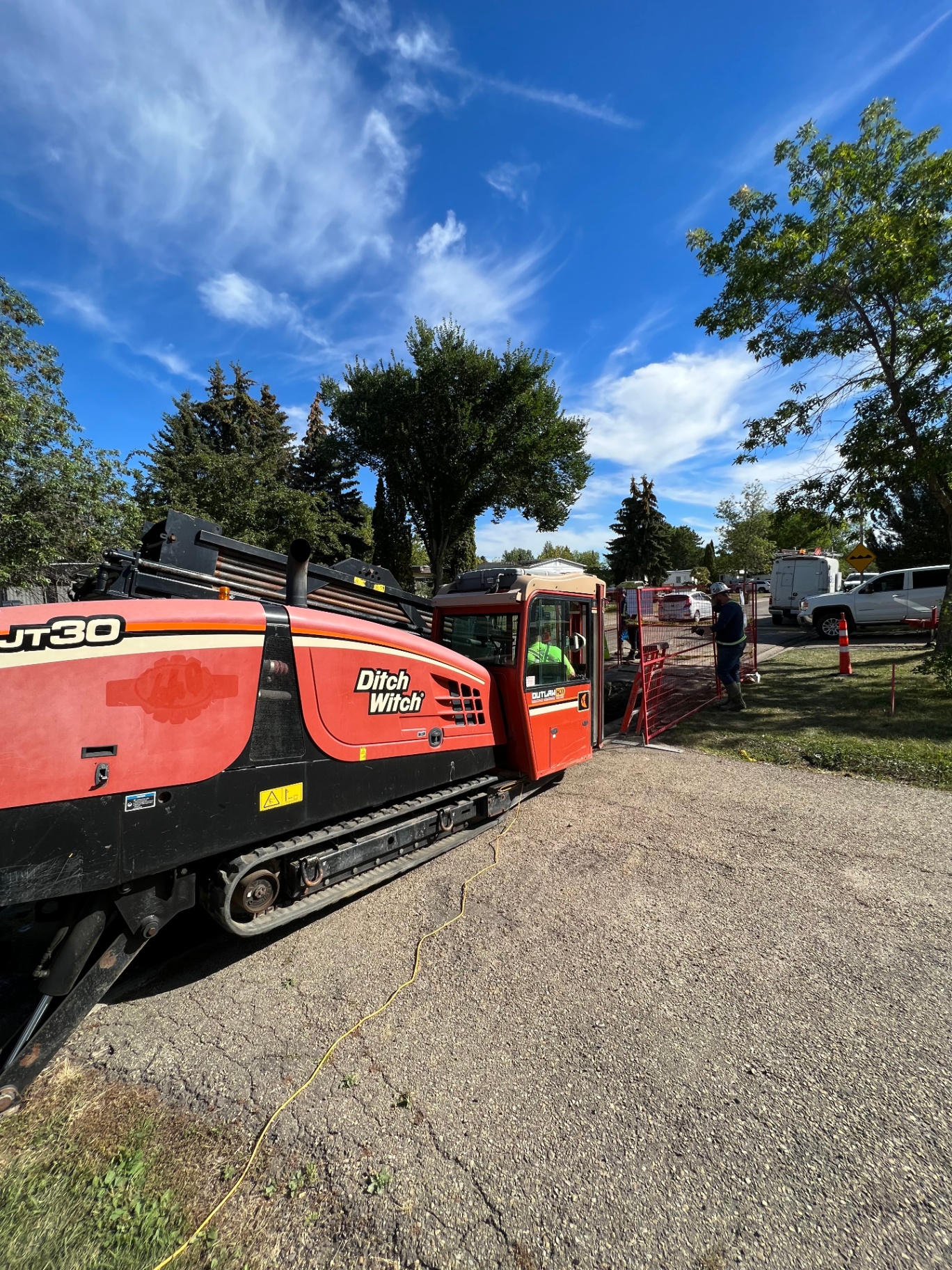 Ditch Witch JT30 directional drill setup on residential street