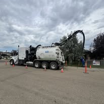 ASI Tech hydrovac truck staged on parking lot work site